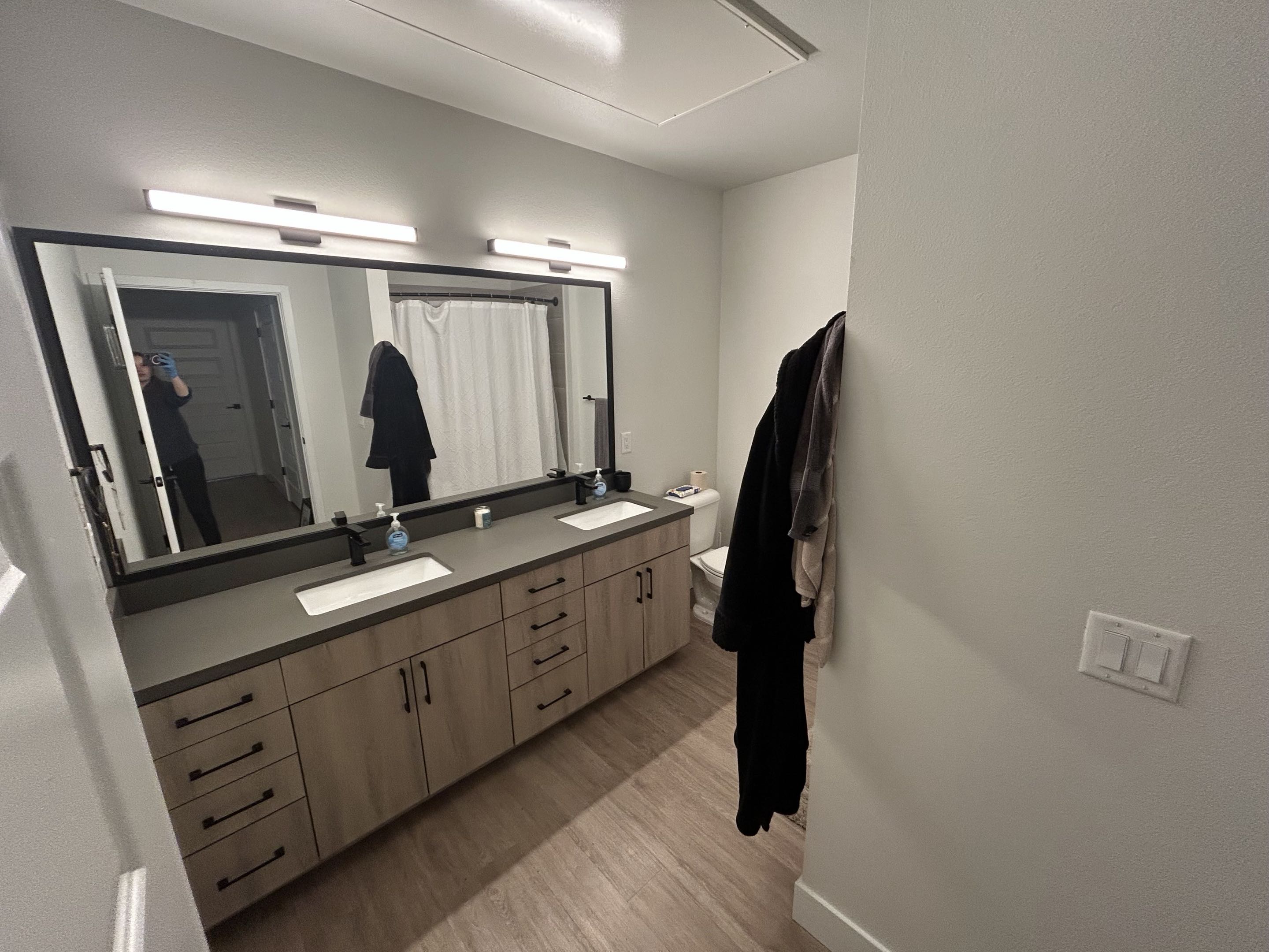 Clean double-vanity bathroom with spotless counters and mirror